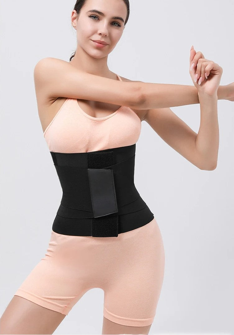 a woman wearing a black waist trainer belt