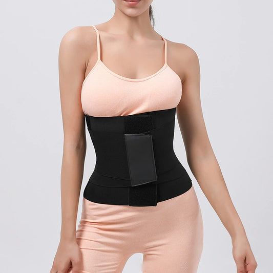 a woman wearing pink top and legging and a black waist trainer belt