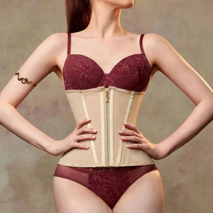 a woman wearing a beige Enviable Beauty fajas colombianas strapless waist trainer and panties with her hands on her hips