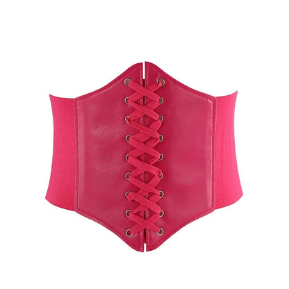 a pink corset with laces on it