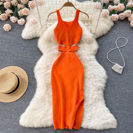 an orange dress and hat on a fur rug