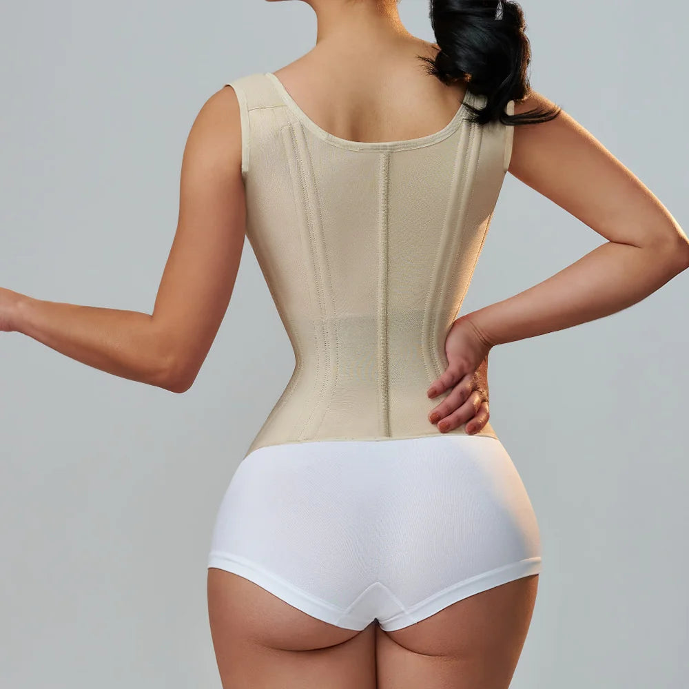 a woman in a beige Enviable Beauty fajas colombianas classic waist trainer with her back to the camera