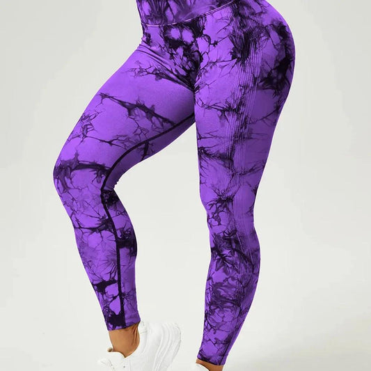 a woman in purple marble print leggings