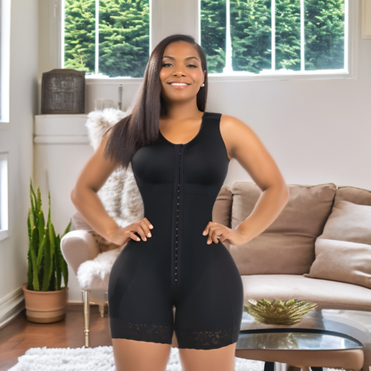 a woman in a black butt lifter postpartum girdle bbl bodysuit standing in a living room